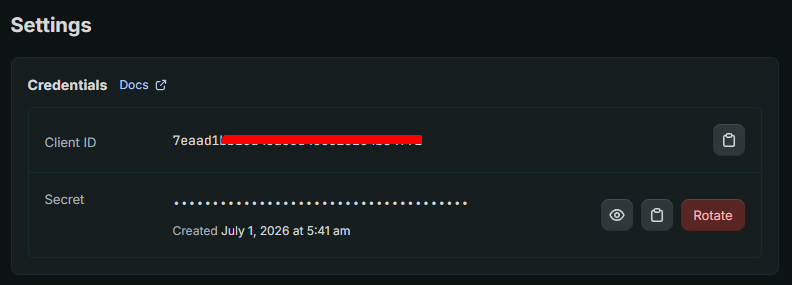 App Settings tab showing the Client ID (partly redacted) and a hidden Client secret with a Rotate button.